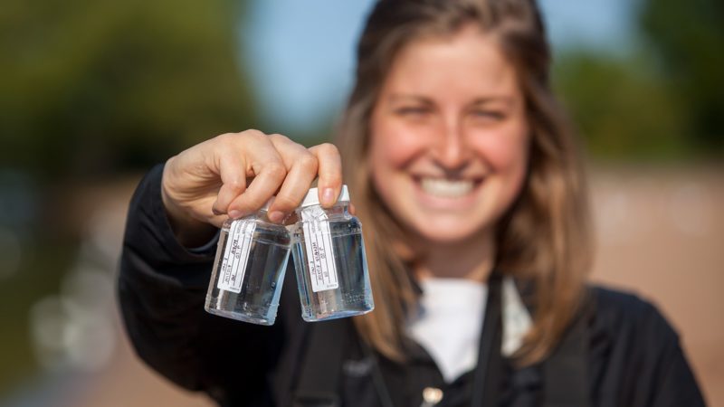 student with water samples